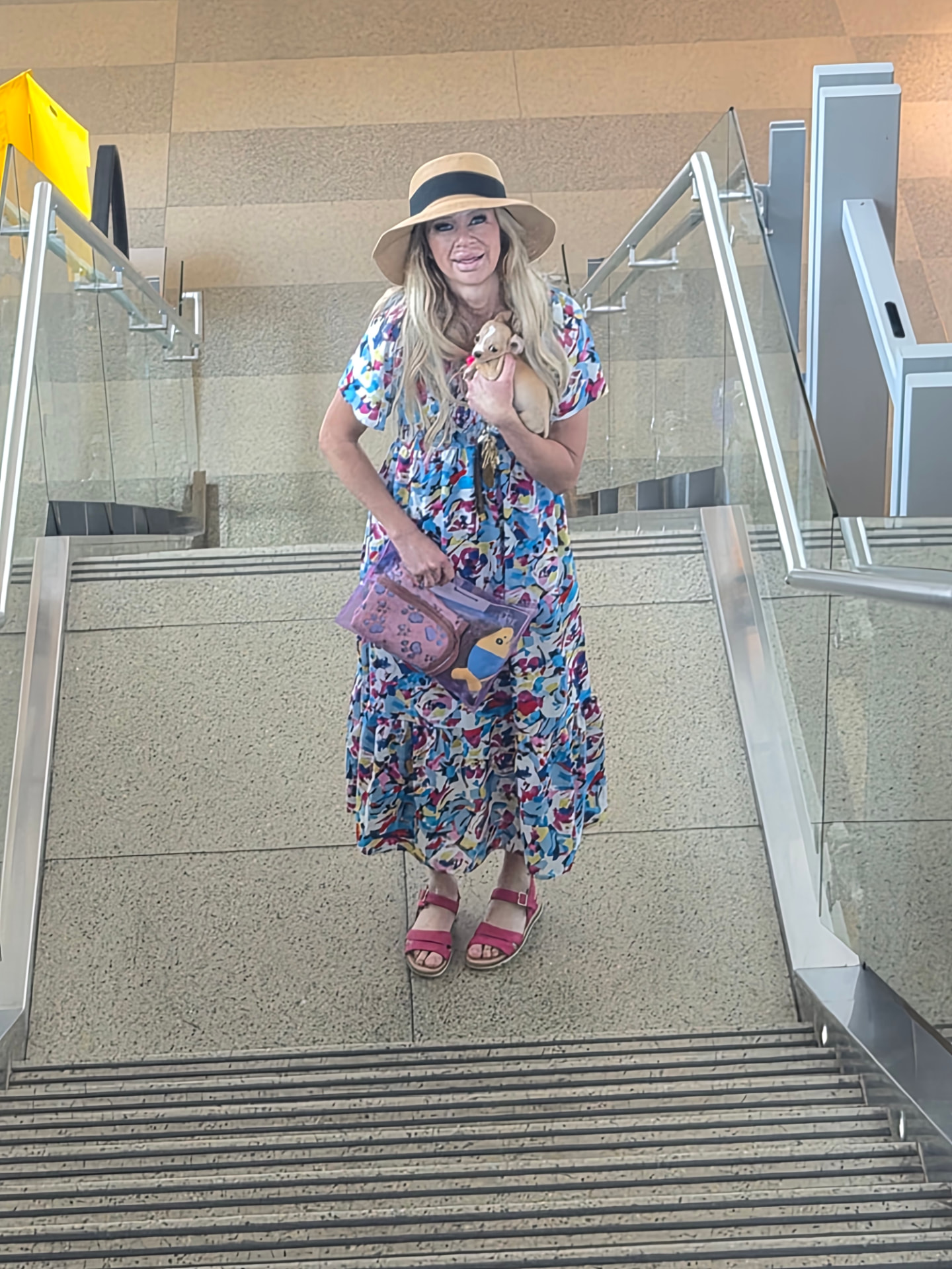 Down the terminal stairs with a little one tucked in arm